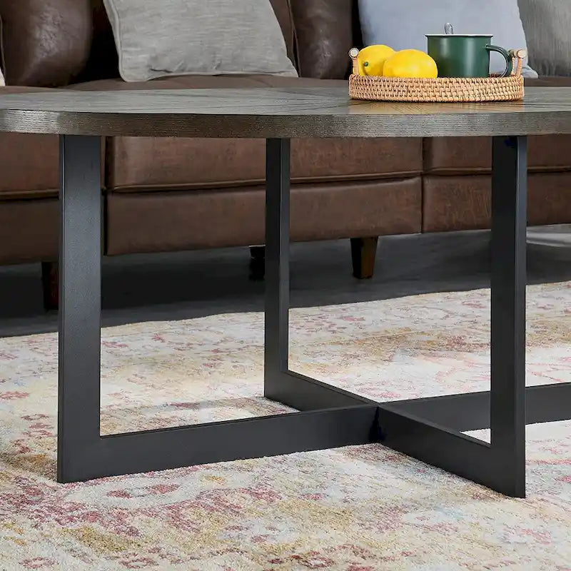 Table basse ovale en frêne avec piètement croisé en fer et étagère à 2 niveaux